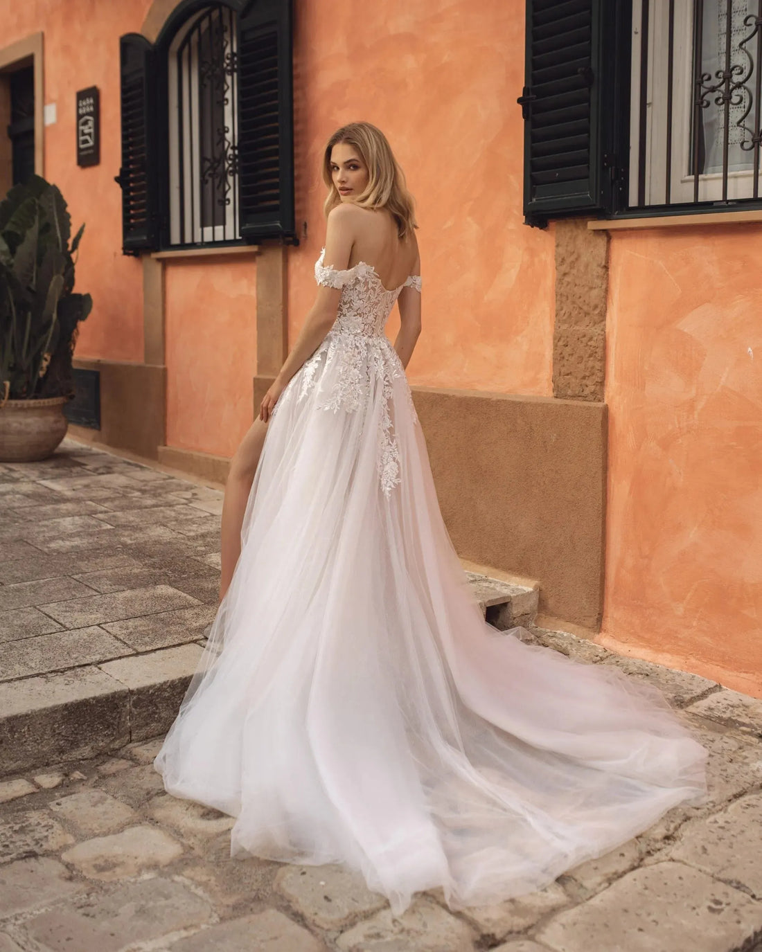 Romantic A-Line Wedding Gown with Off-Shoulder Sleeves, and a Flattering Natural Waistline for an Enchanting and Timeless Bridal Look