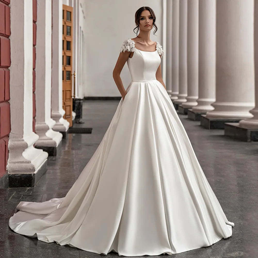 Hermosos vestidos de novia de satén, mangas cortas, escote redondo, flores, cola de corte, vestidos de novia de princesa de corte A con bolsillos, vestidos de novia 