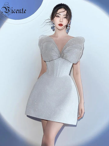 VC Glamorous White Strapless Mini Dress with Sparkling Butterfly Detailing for a Gala Event