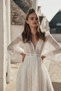Graceful Beach Wedding Dress with Long Sleeves, V-Neckline & Delicate Lace for a Timeless and Romantic Bridal Look