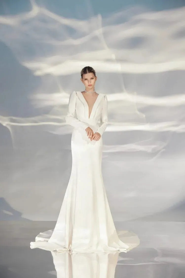 Sophisticated A-Line Wedding Gown with Long Sleeves, V-Neckline, and a Natural Waistline for a Modern and Elegant Bridal Look